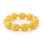 Браслет "Солнце" из имитации янтаря молочного имитация, зерно 15х20мм
